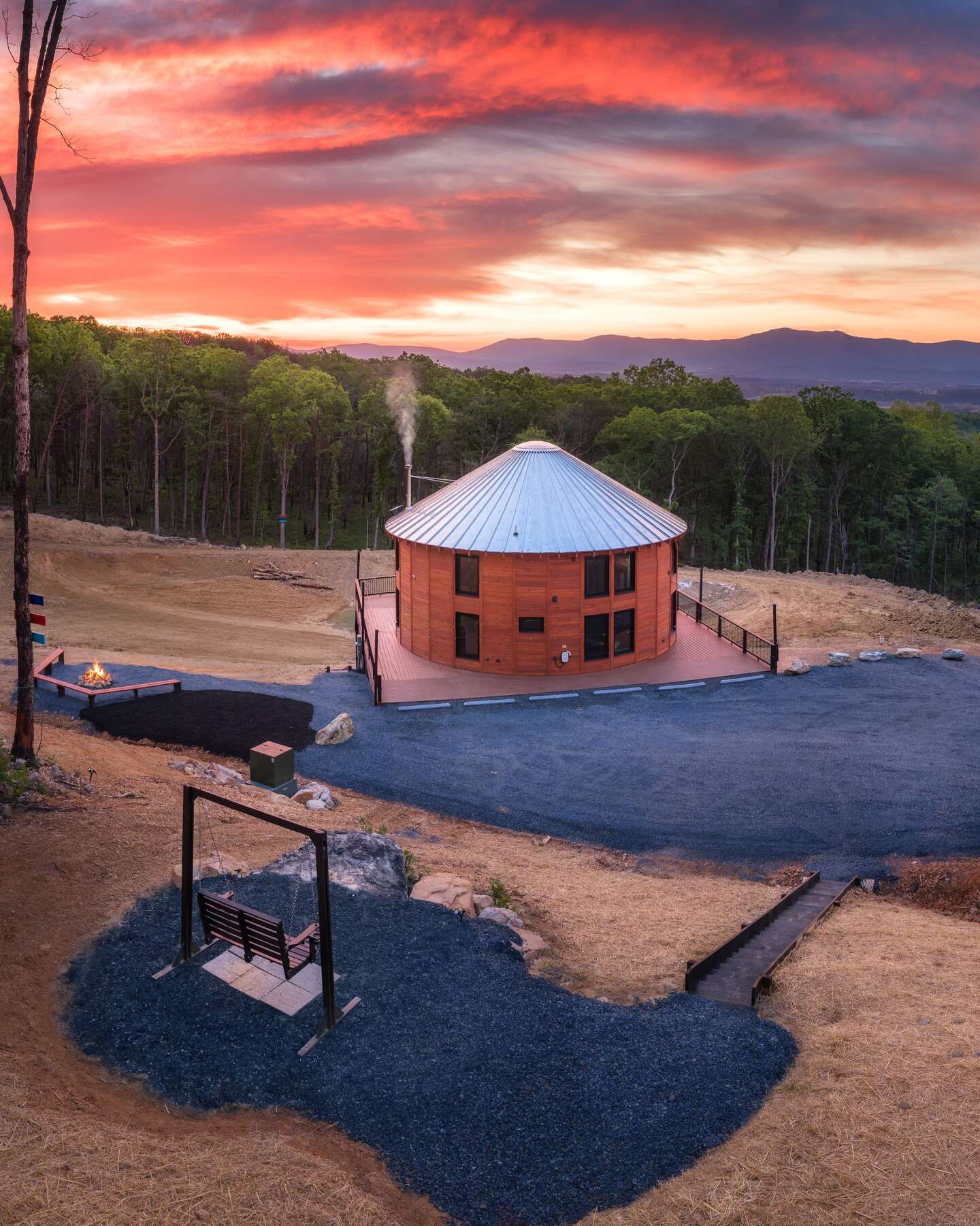 The building at sunset, metal roof and larch siding